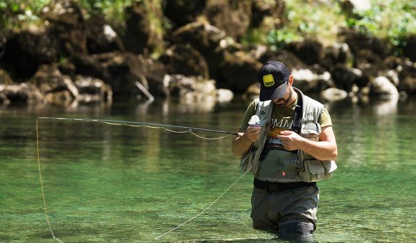 fly-fisherman-flyfishing-in-river-P75BY2G-resize.jpg